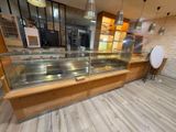 an image of a kitchen with a counter and a glass case