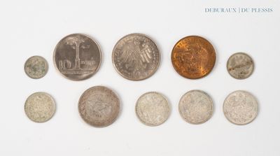 a lot of coins that are on a white surface