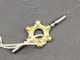 a silver and gold necklace with a gold star on it
