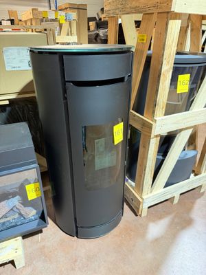 a black trash can sitting next to a stack of boxes