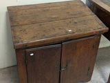 two wooden tables with drawers on them in a room