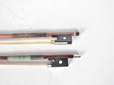 three different types of violin bows on a white surface