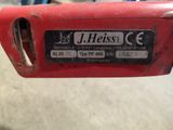 a close up of a red object with a sticker on it
