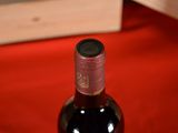 a bottle of wine that is sitting on a table