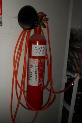 a fire extinguisor that is attached to a wall