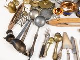 many different types of silverware on the table