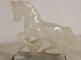 statue of a white horse on a marble base on a white background