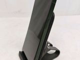 a cell phone that is sitting on a stand