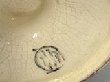 a white plate with a black design on it