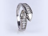 a close up of a diamond ring on a white background