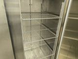 a metal shelf with shelves in the middle of it