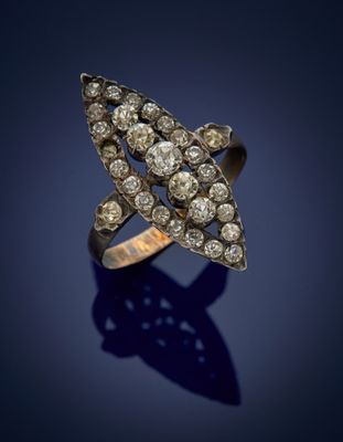 a close up of a diamond star ring on a blue background