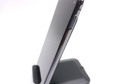 a cell phone that is sitting on top of a stand
