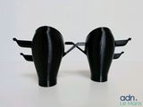 two black elephant shaped glasses sitting next to each other