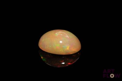 a close up of a white oplite on a black background