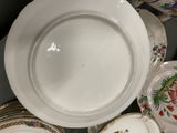many plates and bowls that are sitting on a table