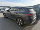 the back of a gray mercedes suv parked in a parking lot