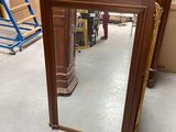 a mirror that is sitting on the floor in a room