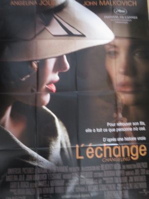 affiche de cinéma représentant une femme portant un chapeau, avec un homme en arrière-plan