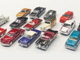 a lot of toy cars that are lined up together