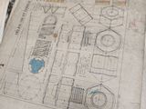 une feuille de papier sur laquelle figurent des dessins, posée sur une table