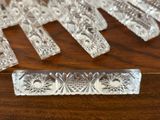 a lot of clear glass pieces on a wooden table