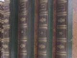 several books are stacked on top of each other on a table