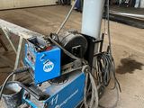 a machine that is sitting on the ground in the garage