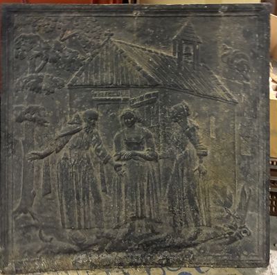 une photo d'une plaque sur laquelle figurent un homme et une femme tenant un parapluie