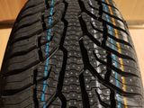 a close up of a tire on a wooden floor
