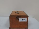 a small wooden box with a number on it