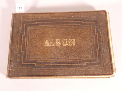 an old book with a name on it sitting on top of a table