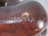 a close up of a sculpture of an apple on a table