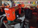 a tractor that is parked in a garage