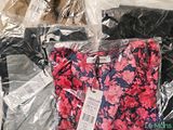 a pile of clothing wrapped in plastic bags on a table