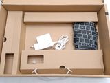 a box with a keyboard, mouse, and charger in it
