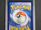 a close up of a pokemon card in a plastic case