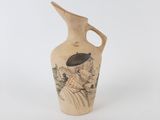 un vase sur lequel est représenté un homme