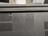 a close up of a laptop with a battery on it