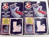 three stickers of a toilet with a bird on the lid and a toilet roll in the middle