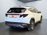 the rear end of a white suv parked in a garage