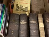 many books in a box on the floor