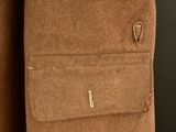 an image of a close up of a brown jacket with a zipper