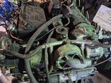 a very old engine that is on display in a room
