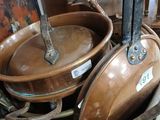 many pots and pans that are sitting on the floor