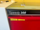 a red dishwasher with a speedy 300 sign on it