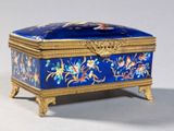 a blue and gold box with flowers on it