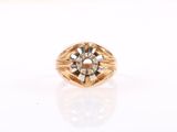 a close up of a gold ring with diamonds on a white surface