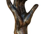 sculpture of a bronze hand on a wooden base