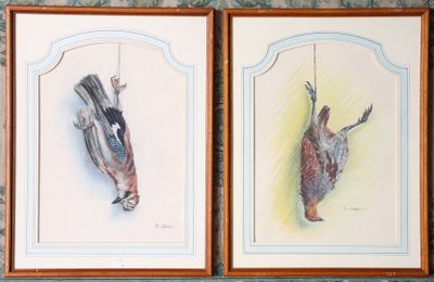 two paintings of birds hanging on a wall in a room